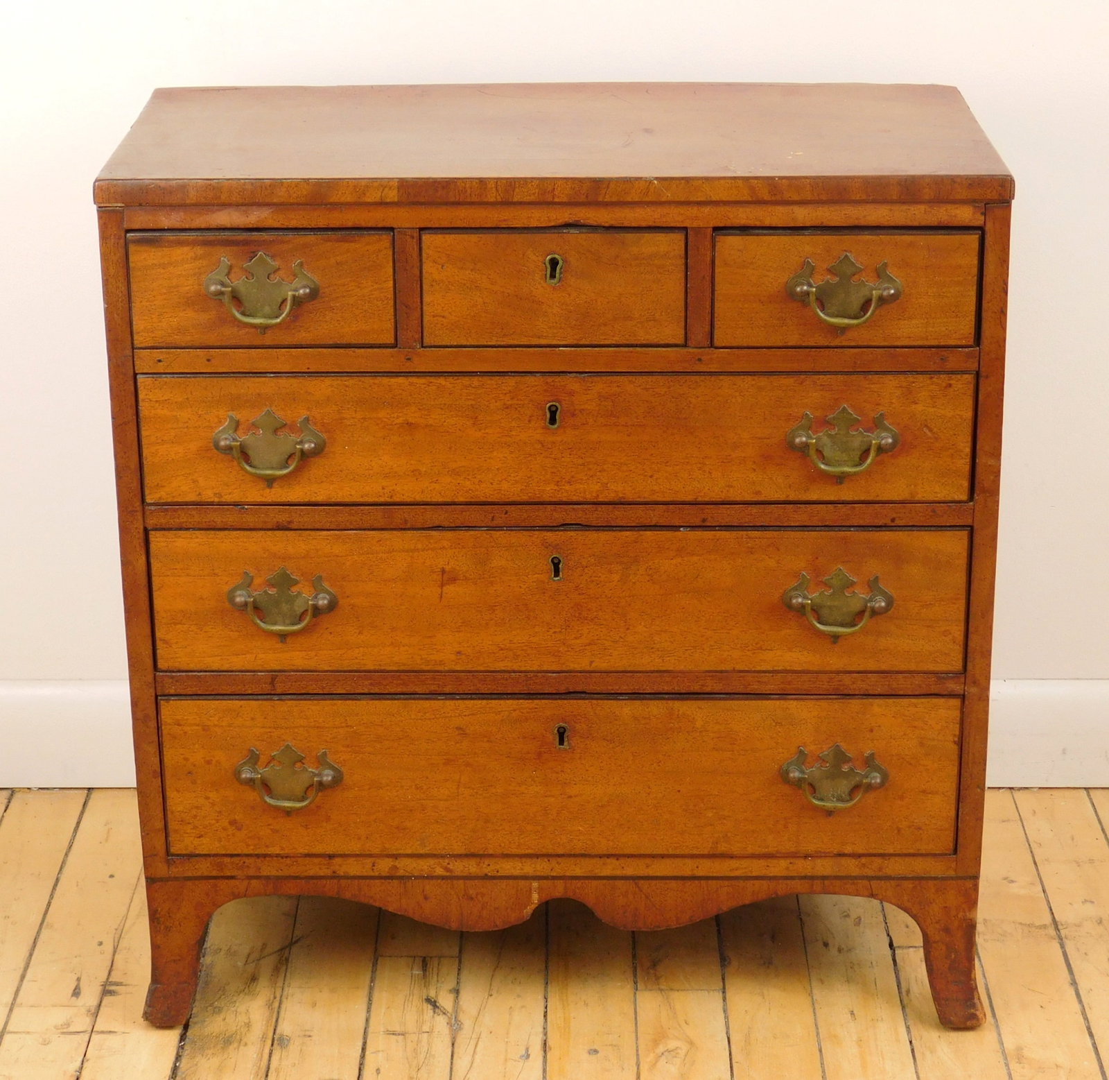 Late 18th c. English Hepplewhite miniature chest: in mahogany, fitted with three short and 3 long graduated drawers with beaded edges, set on French feet with shaped apron. 20 3/4 x 21 3/4 *** PLEASE READ: IMPORTANT NOTE About S&H *** S&H of th