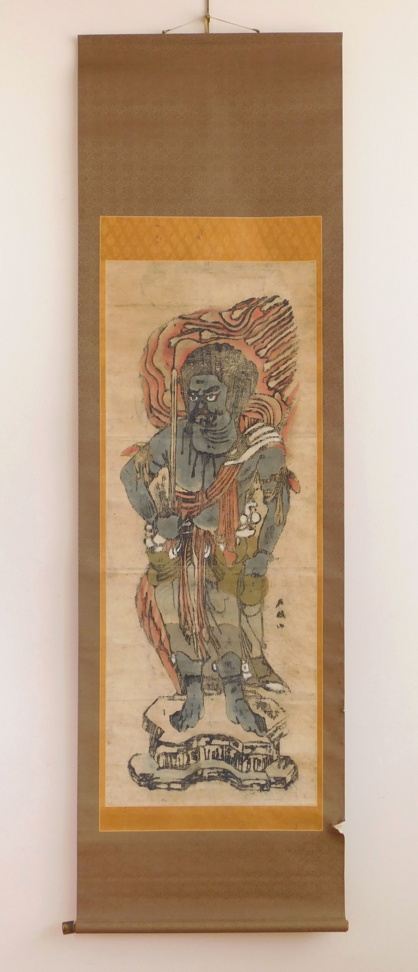 Japanese Edo period hanging scroll: Fydo Myoo- hanging scroll, the guardian deity holds a sword in his right hand to cut through delusion and ignorance,,and a rope in his left hand to bind demons and negative passions. 46 x 18&quo