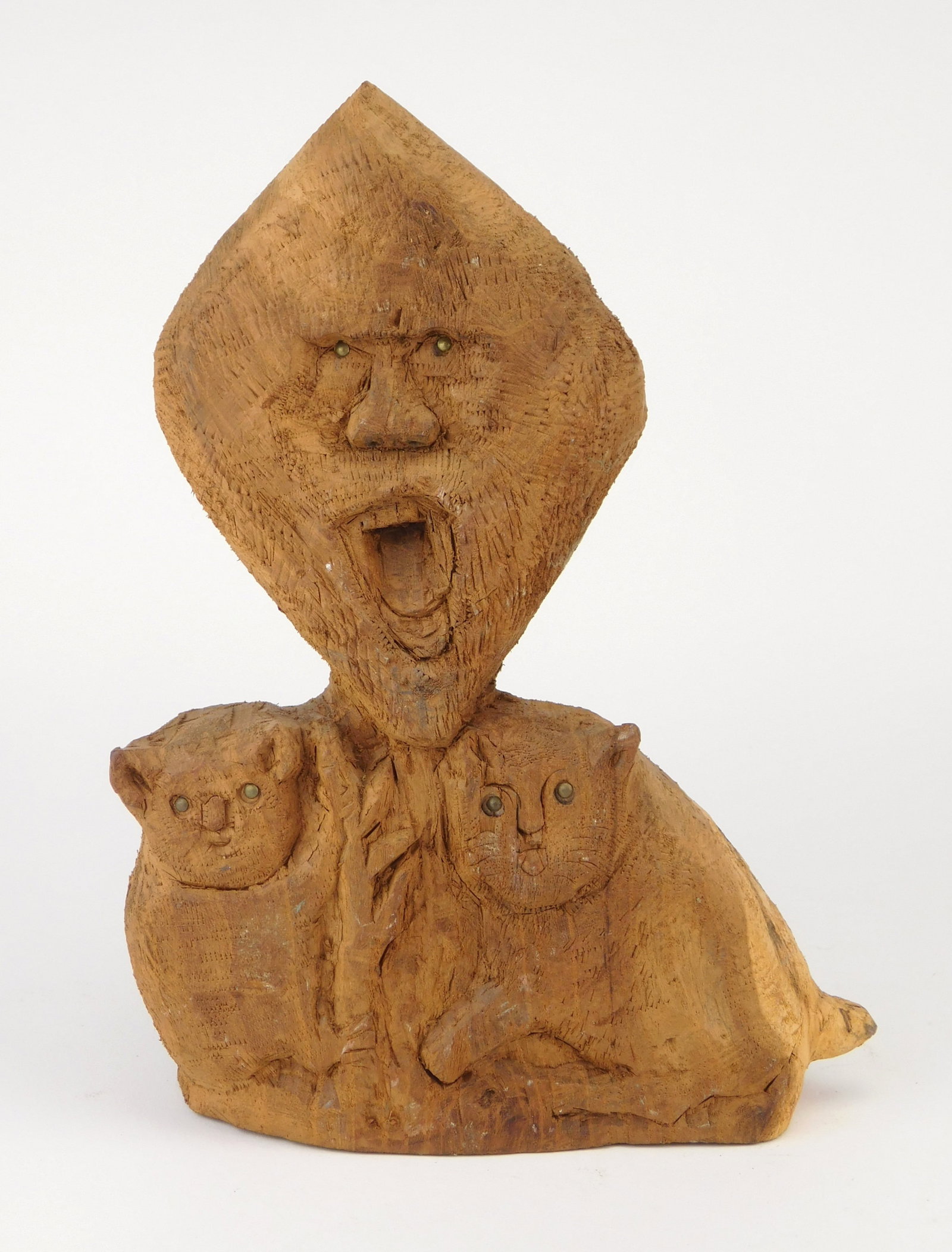 Silvio Zoratti (Italian/ American, 1896-1992) carving: Screaming Face with Cat and Koala Bear wood carving with tack eyes, 1960, stamped on base Made by S. P. Zoratti/ 1960. 10 5/8 x 7 1/2" x 3" Provenance: Descent through the family