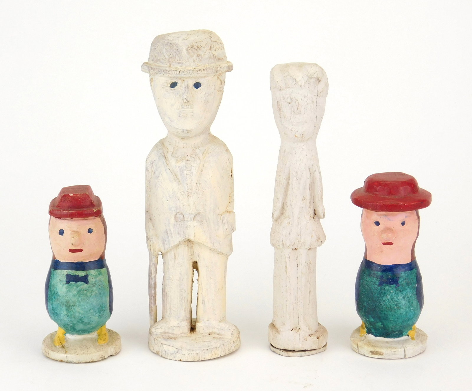 4 Silvio Zoratti (Italian/ American, 1896-1992) carvings: 1 & 2). Man and Woman- 2 painted wood sculptures. 8 1/4; 7 1/2" 3 & 4). Two Birds with Human Heads- 2 painted wood sculptures. 4 1/2"h Provenance: By descent