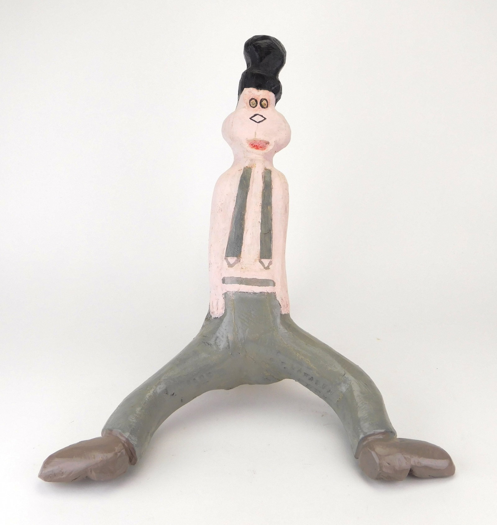 Silvio Zoratti (Italian/ American, 1896-1992) carving: Figure in Gray Pants carved and painted wood sculpture, 1977, stamped Made By/ S.P. Zoratti/ 1977 inside of legs. 13" x 11 x 14" Provenance: By descent through the