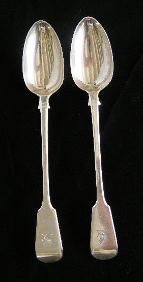 Pair of George IV sterling silver spoons: Pair of English George IV sterling silver stuffing spoons, ca. 1827-28, hallmarked, possibly William Cooper, engraved with Griffin, 276 grams. 12''l Provenance: John Paul Miller, Cleveland, OH