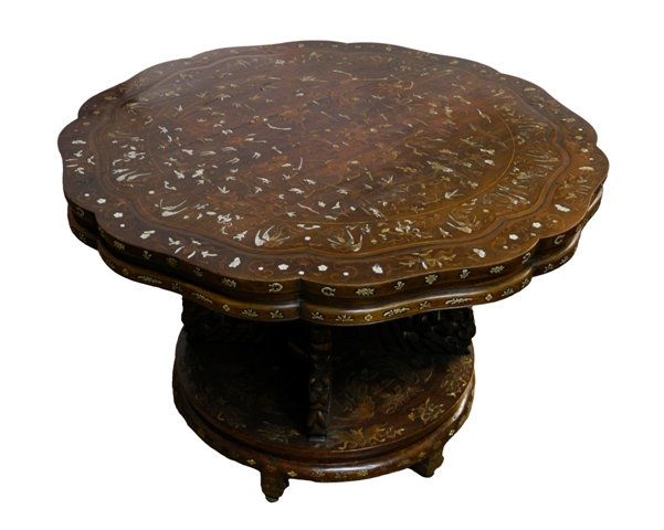 19th Chinese rosewood center table: Late 19th c. Chinese rosewood center table, Chrysanthemum form top in-laid with ivory and wood in a design of clouds, bats, phoenix, prunus and mounted warriors, base is carved with exotic birds. 31''
