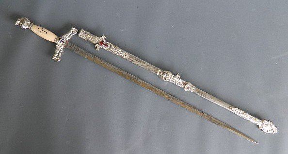 Knights of Templar Ceremonial Sword: Knights of Templar Ceremonial Sword, made by M. C. Lilley & Co., Columbus, OH, with metal sheath. Sheath and blade have inscription Geo. F. Windsor. 36''l Provenance: John Paul Miller collection, Clev