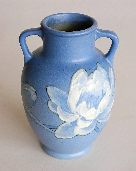 Weller Blue Hudson vase: Weller Blue Hudson vase, with handles, artist Mae Timberlake signed 'Timberlake' lower bottom edge, marked 'Weller Pottery' on bottom, crazing throughout, otherwise good condition. 8''h