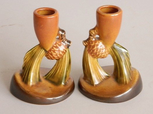Pair of Roseville Pine Cone brown candlesticks: Pair of Roseville Pottery Pine Cone brown candlesticks, marked Roseville 451-4, good condition. 4 1/2''h