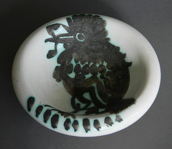 Pablo Picasso ceramic: Pablo Picasso (Spanish 1881-1973)- ''Bird with Worm'' (Ramie 172)- enameled earthenware bowl with oxidized paraffin decoration, 1952, glazed signature on underside, edition of 500, very good condition