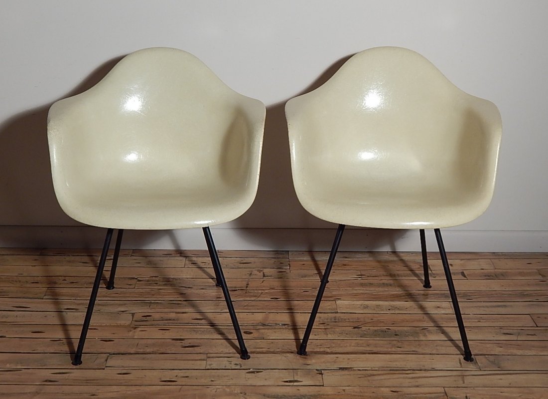 2 Charles and Ray Eames Shell Chairs: 2 Charles and Ray Eames Shell Chairs by Herman Miller, molded pale yellow fiber glass shell with zinc rod legs, 1 foot is detached, wear on both. 31 x 24 x 18''