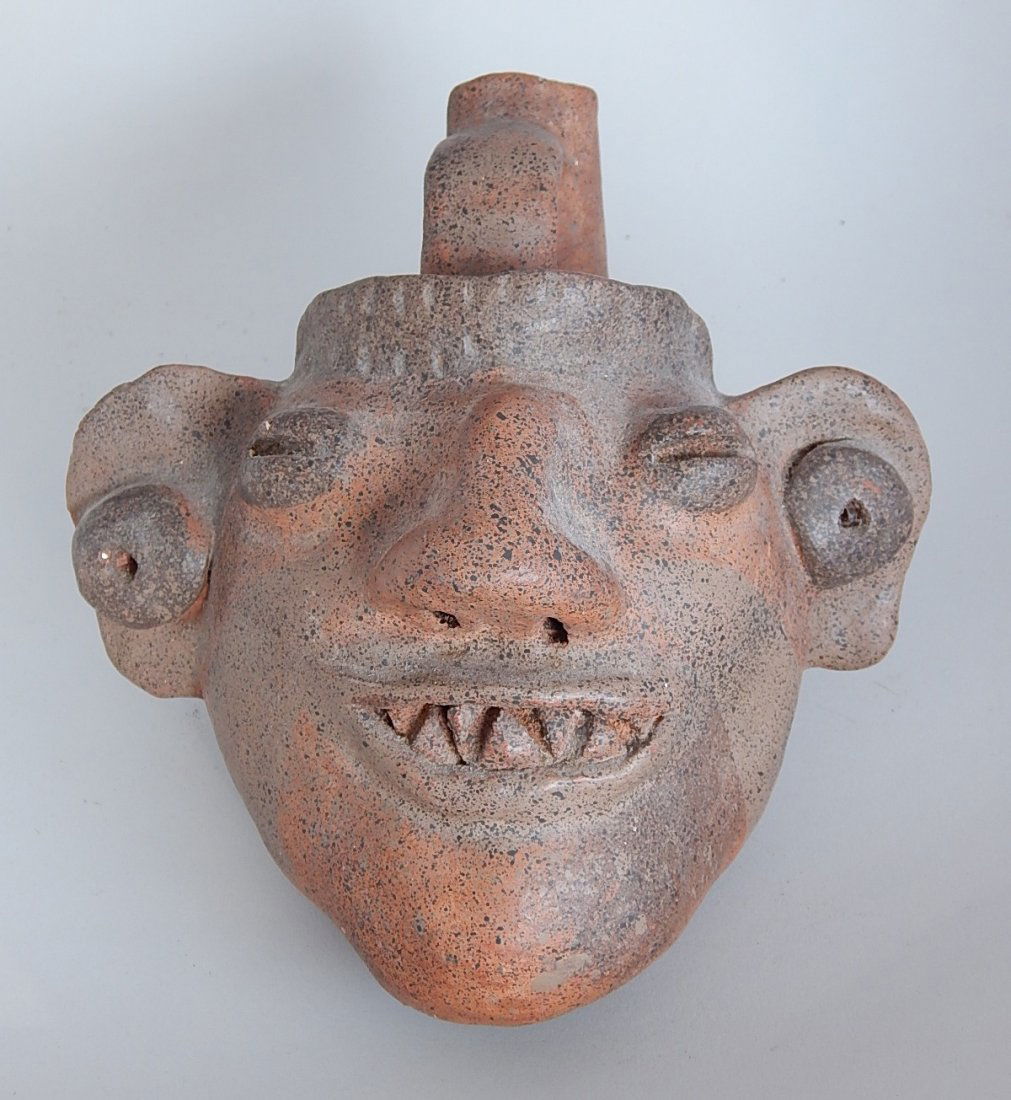 Pre-Columbian red earthenware jar: Pre-Columbian red earthenware jar- Smiling Head, one handle. 5 1/2''h, 8''d