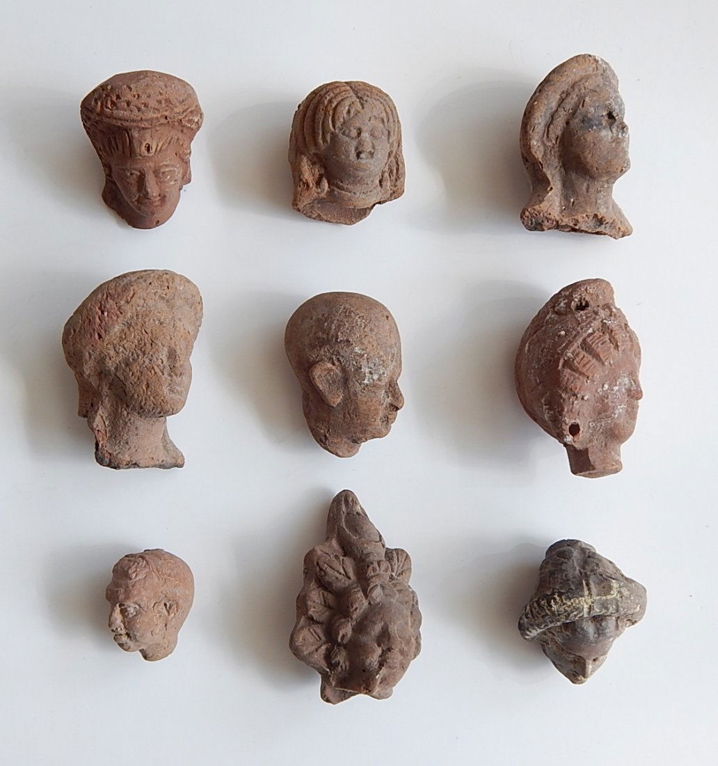 9 Pre-Columbian red earthenware fragments: 9 Pre-Columbian red earthenware fragments- heads.