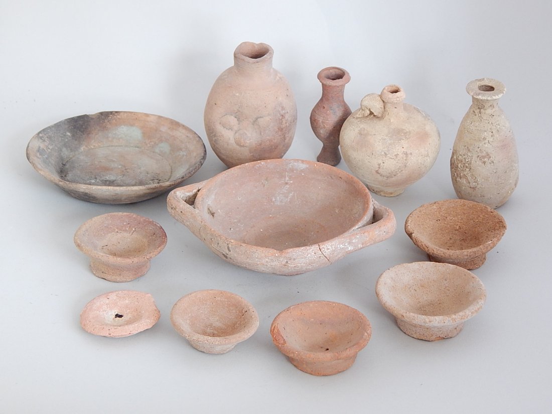 8 Pre-Columbian red earthenware footed dishes: 8 Pre-Columbian red earthenware footed dishes, together with 4 miniature water jugs, various sizes.