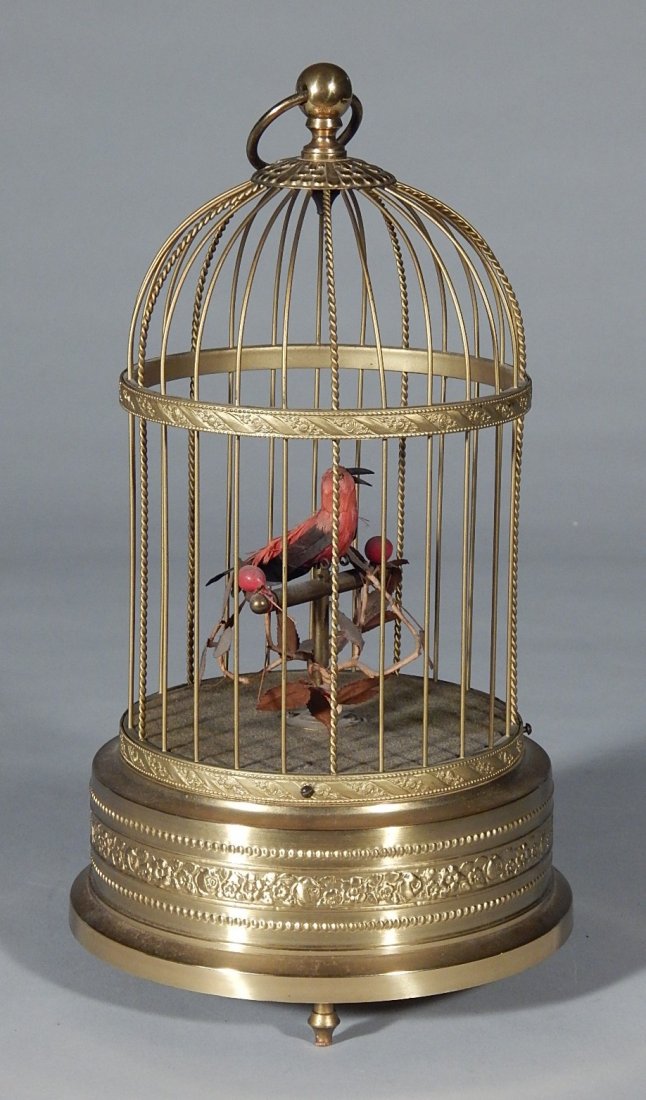 Musical mechanical birdcage: Musical mechanical birdcage, gilded metal cage with 1 bird, not working. 11''h