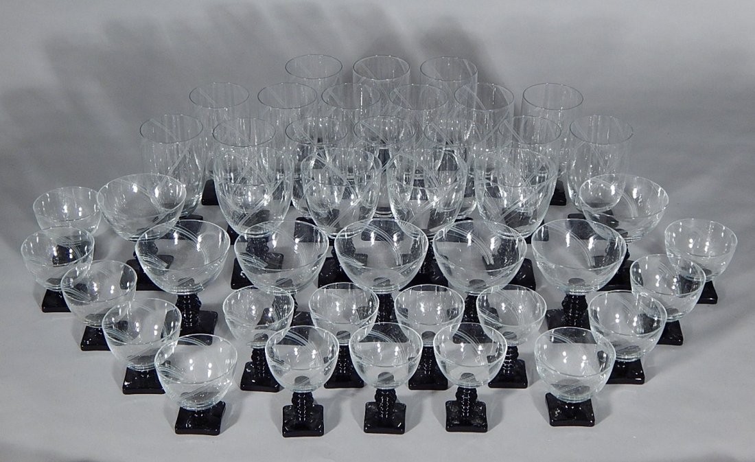 43 Morgantown cocktail glasses: 43 Morgantown cocktail glasses, with square black base and straw shape stems, good condition. 5 1/2''h, 5 7/8''h, 4 1/2''h, 3 1/2''h and 3''h