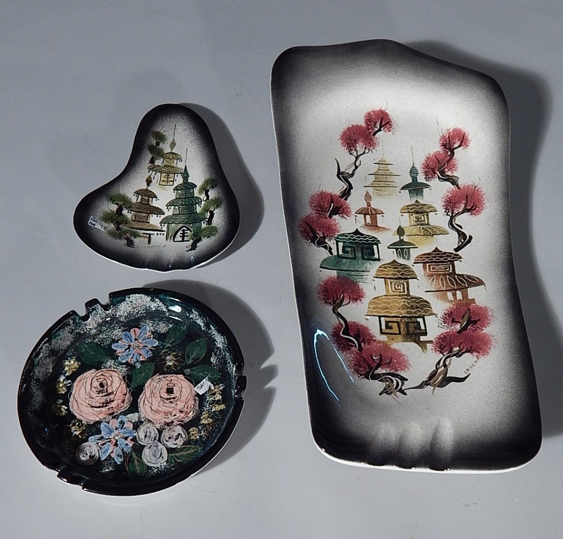 3 Sascha Brastoff pottery ashtrays: 3 Sascha Brastoff pottery ashtrays- 2 depicting pagodas, other floral- all signed, good condition. 8 x 17 1/2 x 2 1/2''; 6 x 8 1/4 x 1''; 7'' dia, 1''h