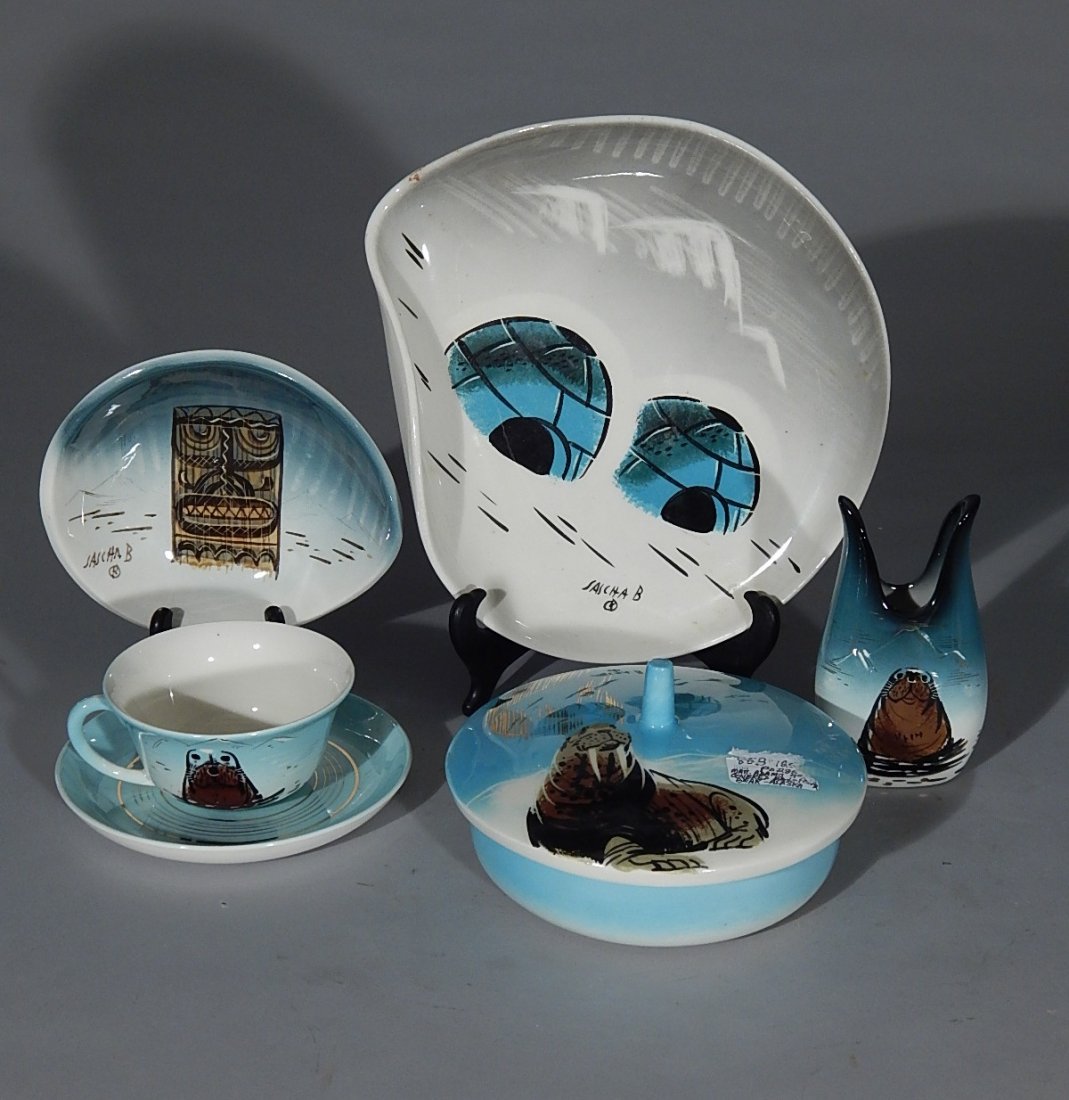 Sascha Brastoff pottery pieces: Sascha Brastoff pottery pieces- vase, 2 dishes and 2 cups and saucers; along with Matthew Adams covered dish, depicting an Alaskan scene, all signed; old sticker remnants, otherwise good condition, va