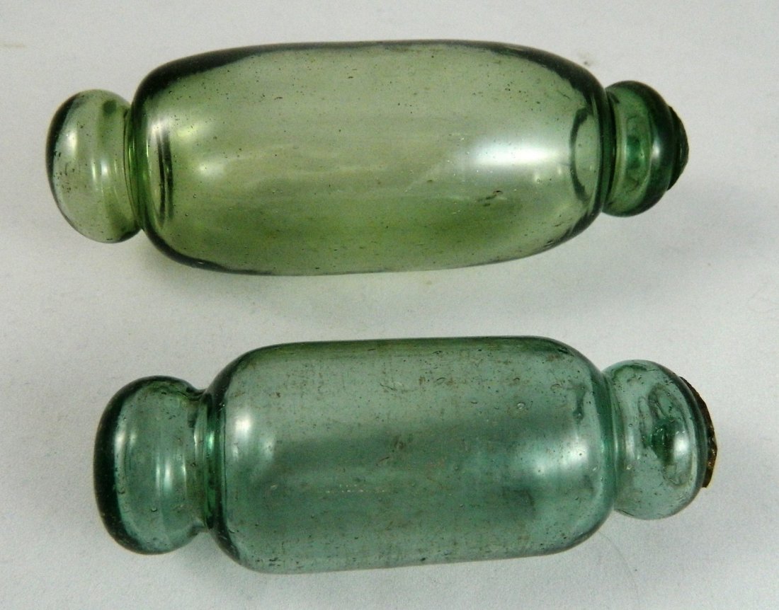 2 Glass floats: 2 Glass floats. 6 1/2''l; 4 3/4''