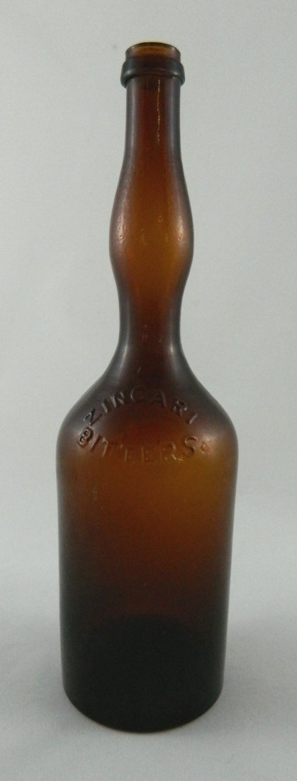 Bitters bottle - Zingari Bitters: Bitters, round, lady's leg, marked on shoulder 'Zingari Bitters / F. Rahter' (Ring & Ham Z4), 3/4 quart, amber, applied mouth with ring, smooth base. 12''h