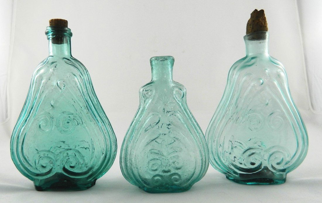 3 Aqua scroll flasks: Flasks- 3 Aqua scroll- 1.) 2 six pointed stars- reverse same, GIX-106, pint, applied mouth with ring, iron pontil; 2.) 2 eight pointed stars- reverse same, GIX-10, pint, sheared mouth, iron pontil; 3.