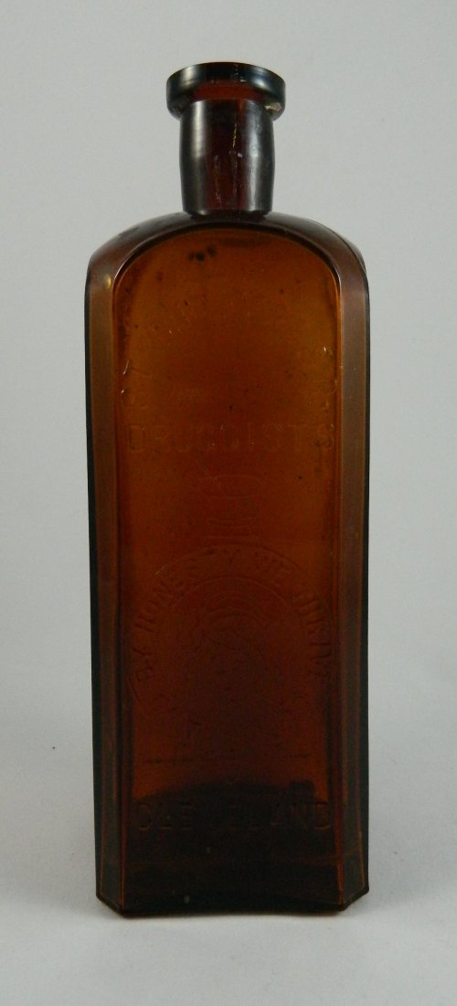 Medicine bottle - Strong Cobb & Co.: Medicine- square with beveled corners and rounded shoulders, 'Strong Cobb & Co. / Druggist / By Honesty We Thrive Est. 1833 / Cleveland O', collared mouth, smooth base. 9 1/2''