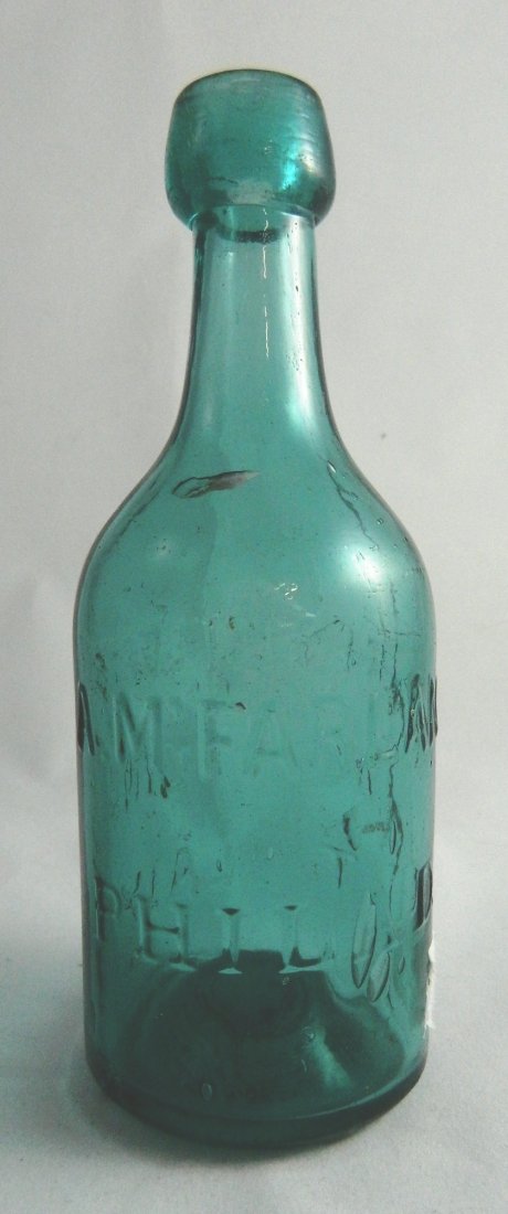 Soda round teal blue bottle: Soda- round, teal blue, marked 'A. M. Farland / Philadela - Registered According to Law', blob collared mouth, iron pontil. 7 1/4''