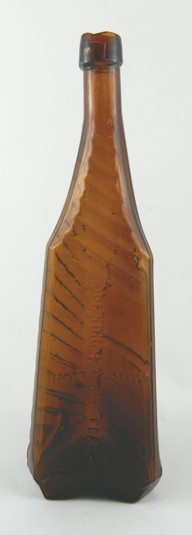 Bitters bottle - Morning Bitters Inceptum 5869: Bitters- triangular, marked on two panels 'Morning' - 'Bitters Inceptum 5869' - 'Patented 5869' (Ring & Ham M 135), 3/4 quart, amber, sloping collared mouth, beveled corners and side, iron pontil. 11 