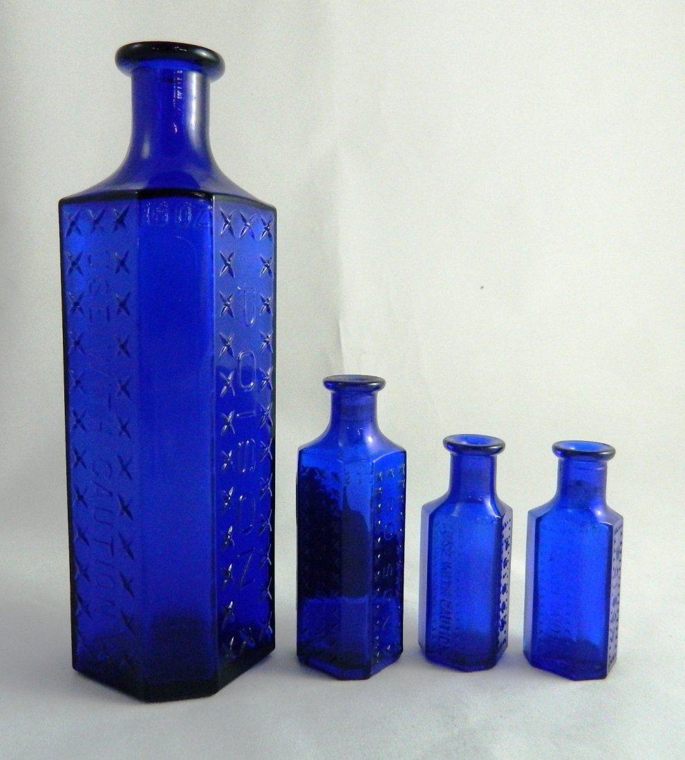 Poison - 4 irregular hexagonal cobalt bottles (1 of 3)