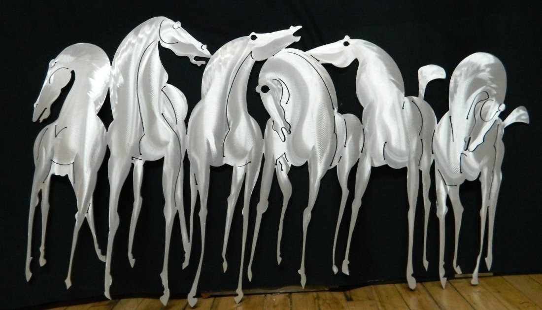 A Don Drumm polished aluminum wall sculpture: A Don Drumm polished aluminum wall sculpture, of Running Horses, done for Rockledge. 25 x 42''