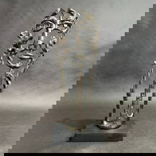 Abstract Aluminum Face Sculpture 16.25 h x 6 w x 4 d: Visage Sculpture  Medium: Aluminum with antiqued nickel finish Size: 16.25 h x 6 w x 4 d Year: 2024 The Visage Sculpture is a striking and modern piece that embodies abstract elegance with its minimal