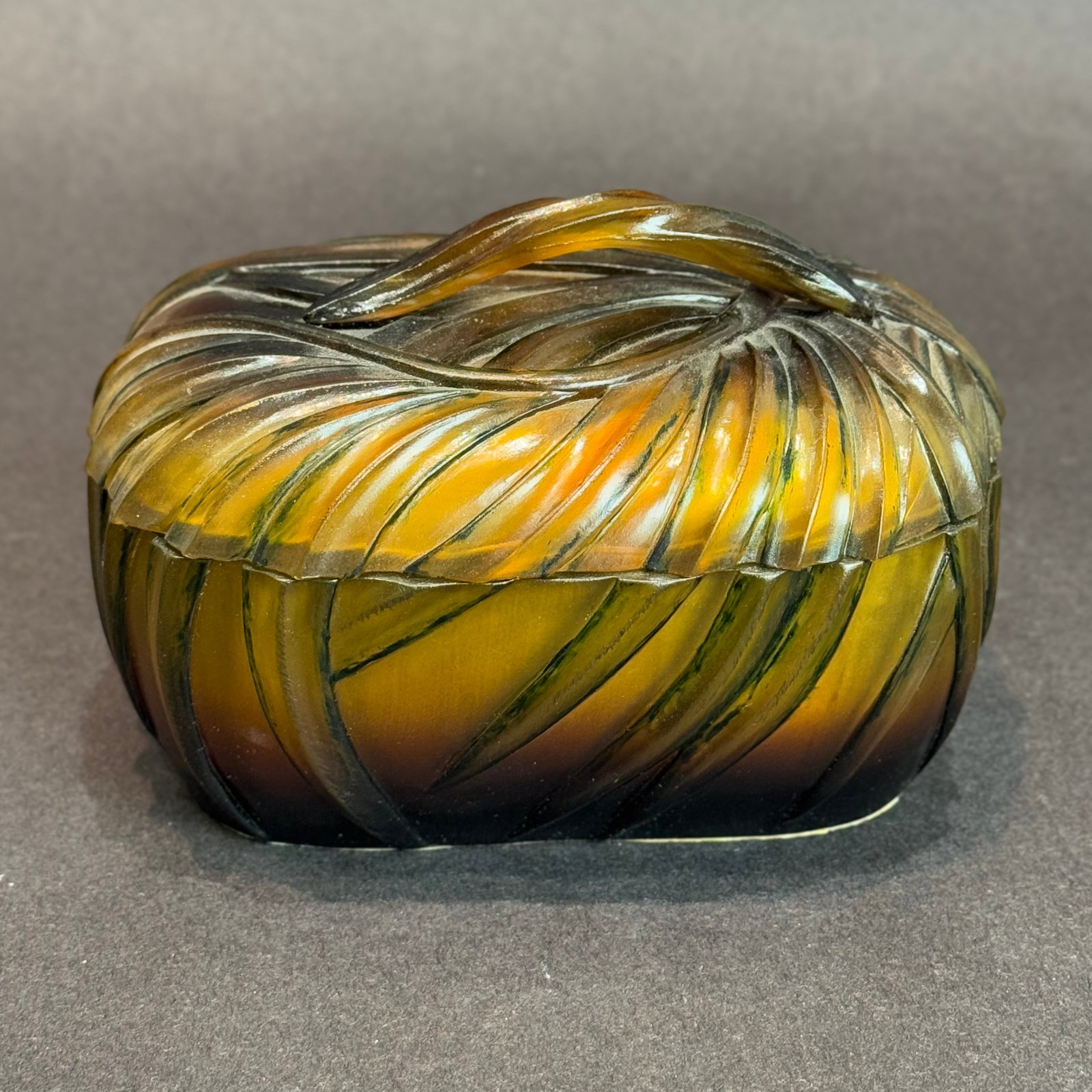 Leaf Motif Trinket Box 6 x 4 x 4.5: Leaf Motif Carved Trinket Box Medium: Carved wood and resin. Size: 6 w x 4 h x 4.5 d Carved with sweeping lines that echo the elegance of autumn leaves, this wooden trinket box exudes a quiet, organic