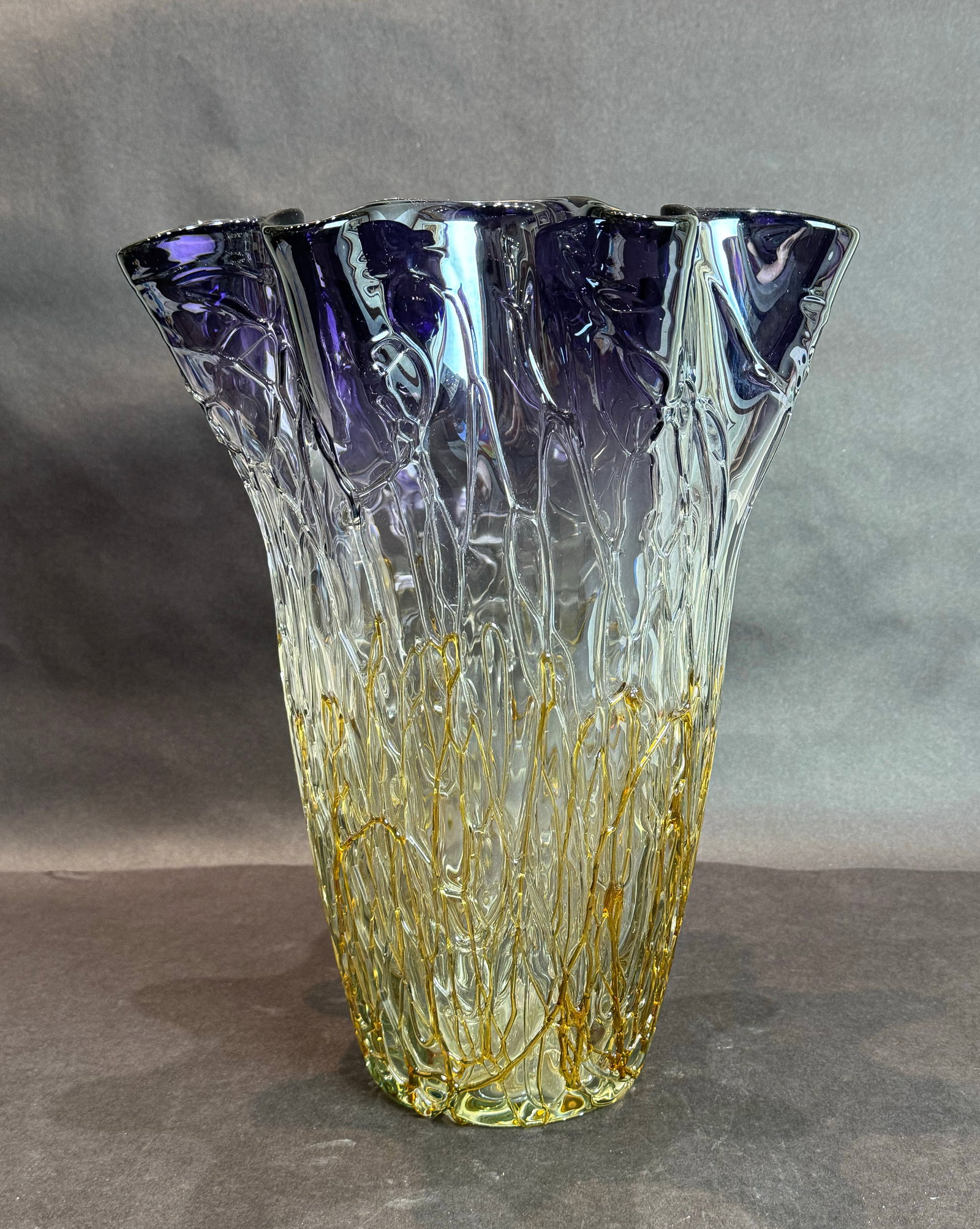 Dale Tiffany Style 14.5 Inch Purple Vineland Glass Vase: Title: Dale Tiffany Style 14.5in Purple Vineland Glass Vase Medium: Hand-rolled Glass Size: 9.5 dia. x 14.5 h The Vineland Vase is a stunning display of glass artistry, with rich gradients of amethyst