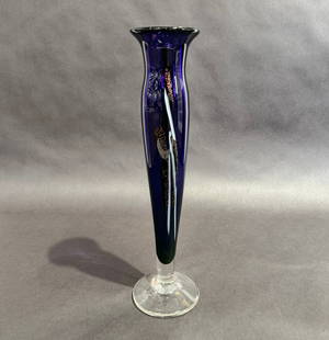 Nicholson Glass Purple Bud Vase 14 diameter: Artist: Nicholson Blown Glass  Title: Purple Bud Vase Medium: Handblown Glass Size: 14 h x 4 dia Signature: Etched signature on bottom of base Production Year: 2000 Artist Biography As