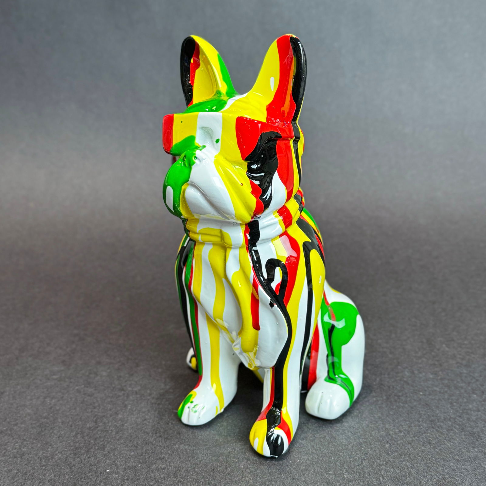 8 inch Multi-Color Paint Drip French Bull Dog with Sunglasses: Graffiti Drip French Bulldog Sculpture Medium: Resin Size: 5 w x 8 h x 4 d Weight: 1.5lbs. This a playful and vibrant dog sculpture that blends graffiti art influences with the charm of the iconic Fre
