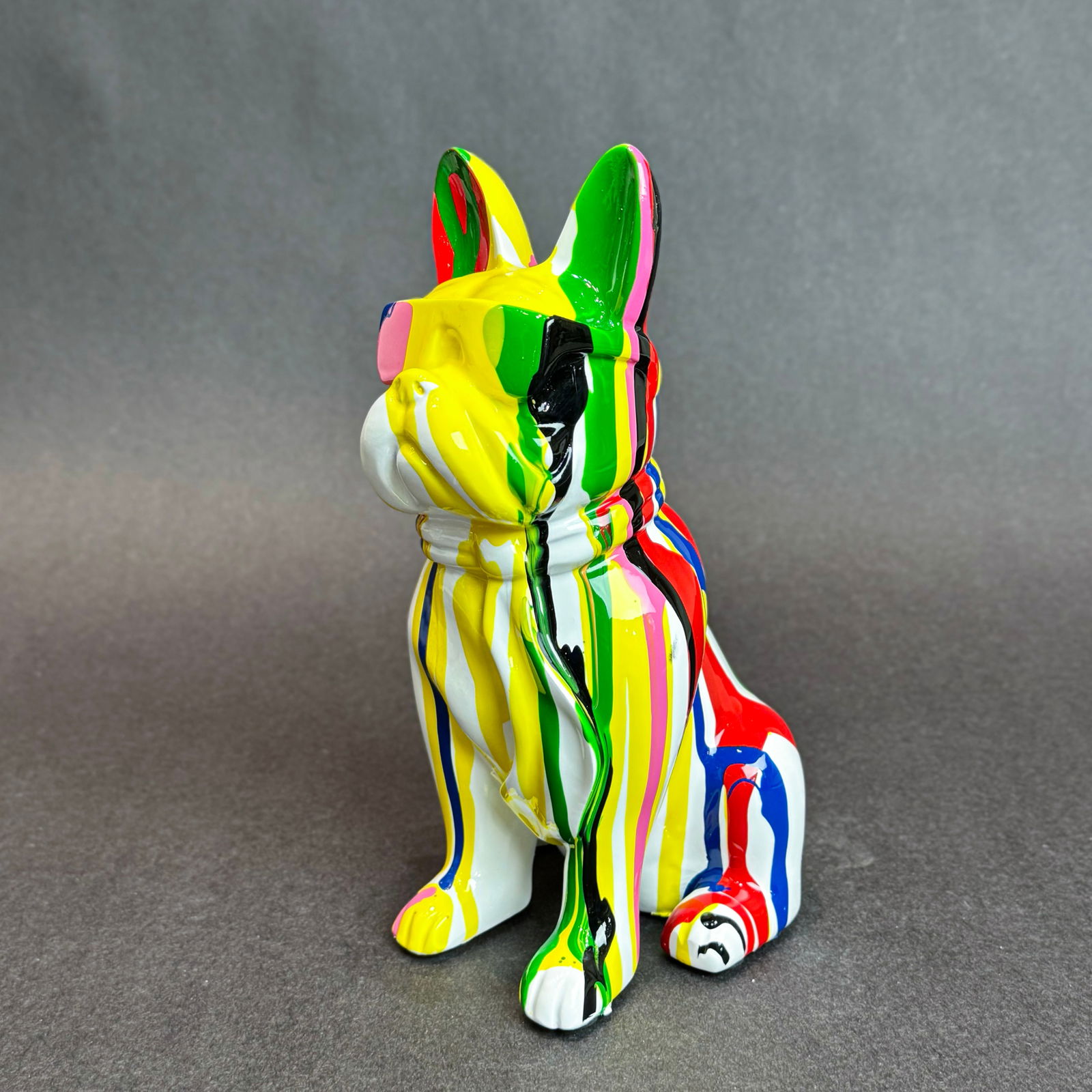 8 inch Multi-Color Paint Drip French Bull Dog with Sunglasses: Graffiti Drip French Bulldog Sculpture Medium: Resin Size: 5 w x 8 h x 4 d Weight: 1.5lbs. This a playful and vibrant dog sculpture that blends graffiti art influences with the charm of the iconic Fre