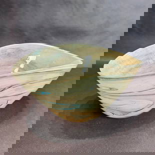 12 inch Kavana Glass Akari Bowl with Blue Swirls: Artist: Kavana Decor Title: 12in Akari Bowl Medium: Hand-blown Glass Bowl Size: 12D x 8.5W x 6.5h Experience the beauty of the Akari Bowl, a stunning addition to any interior. Made from