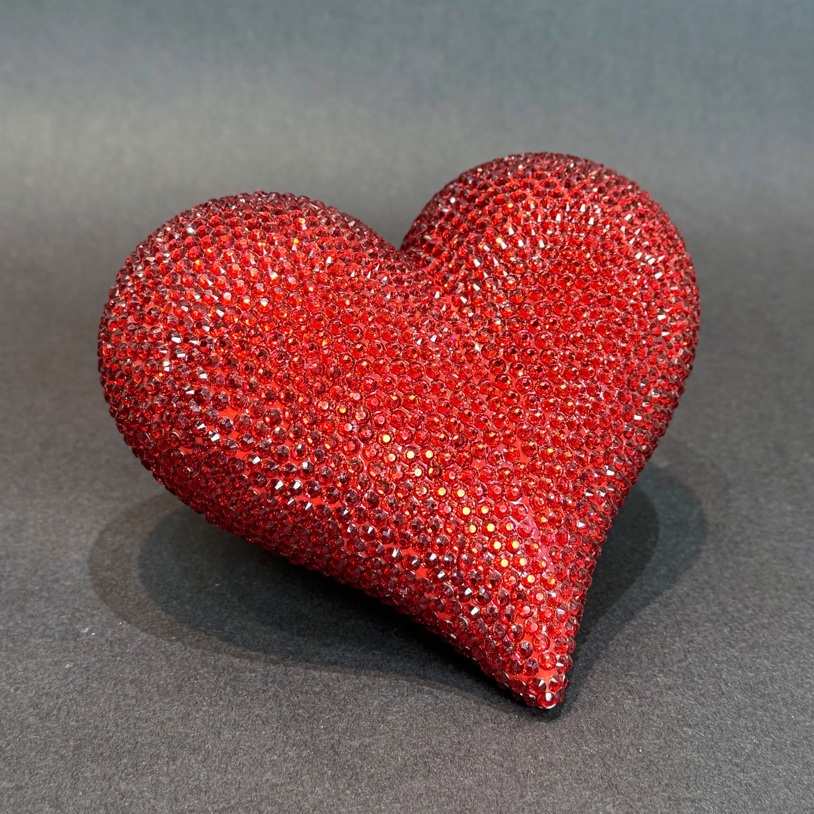 7 inch Rhinestones Ceramic Heart: Rhinestone Ceramic Heart Sculpture Medium: Ceramic with Rhinestones Size: 6.5 D x 7 W x 3.5 H Weight: 2lbs. This heart sculpture dazzles with vibrant color and sparkling rhinestones, creating a bold a