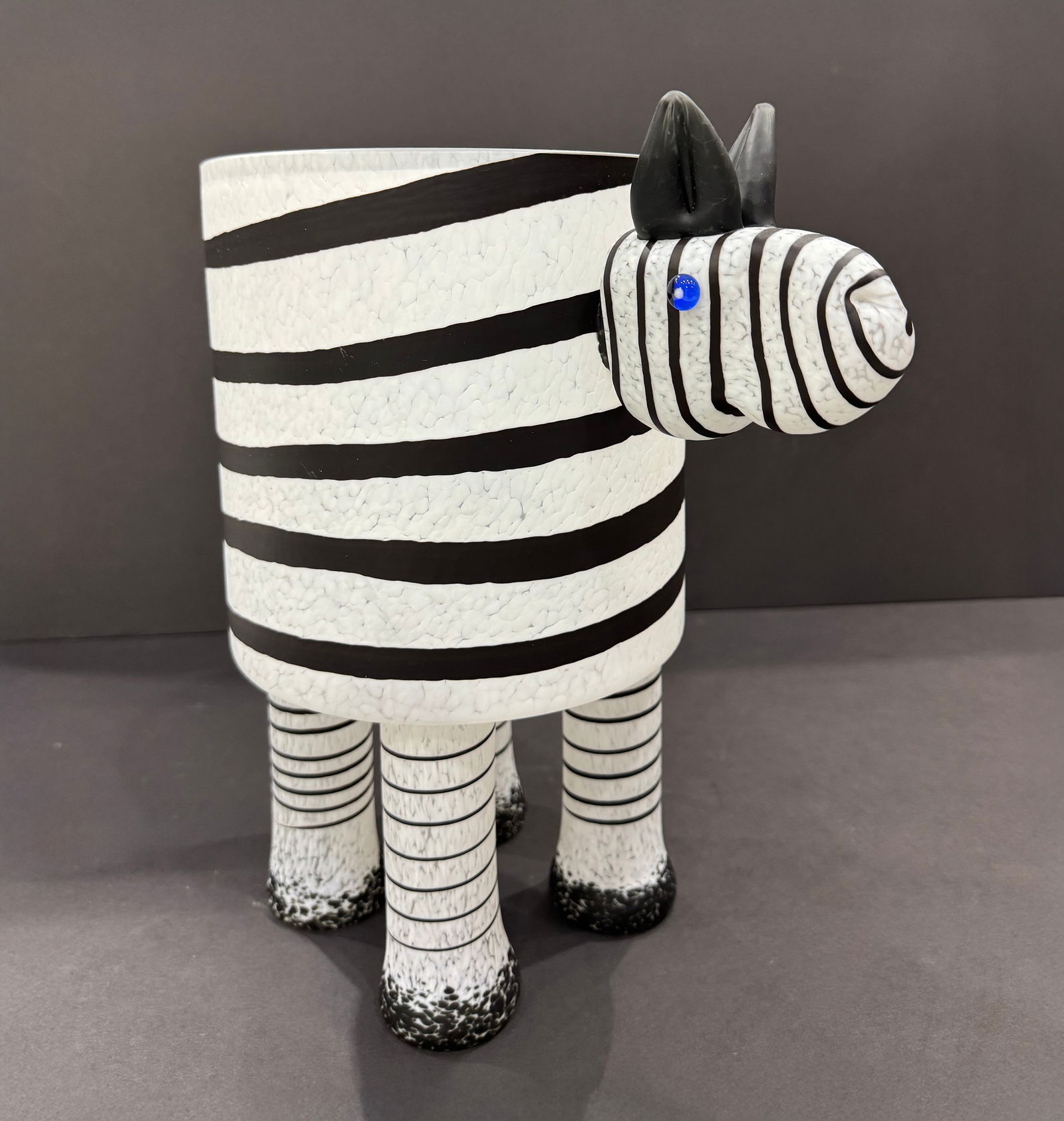 Borowski Art Glass 13 H x 7.75 W Zebra Bowl: Artist: Borowski Art Glass Title: Zebra Bowl Medium: Hand-blown Art Glass Sculpture Size: 13 H x 7.75 W x 12 D Weight: 15 lbs. Signature: Etched in Bottom of Glass This playful zebra bowl by Borowski