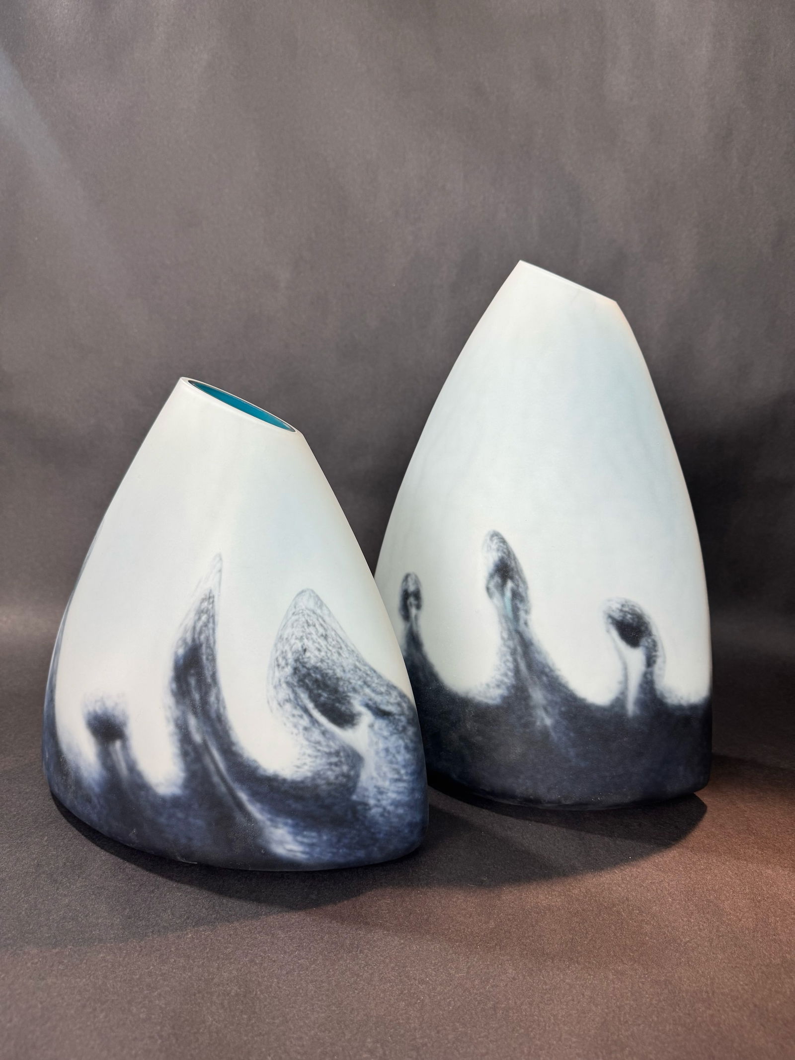 Cyan Design Mystic Falls Vases (Set of 2): Artist: Cyan Design Title: Mystic Falls Vases Set of Two Medium: Glass Size: Large Vase: 14.5 H x 10.25 W x 6.25 D, Small Vase: 10.5 H x 11 W x 5.57 D Weight: 20 lbs. This tabletop accent set is the