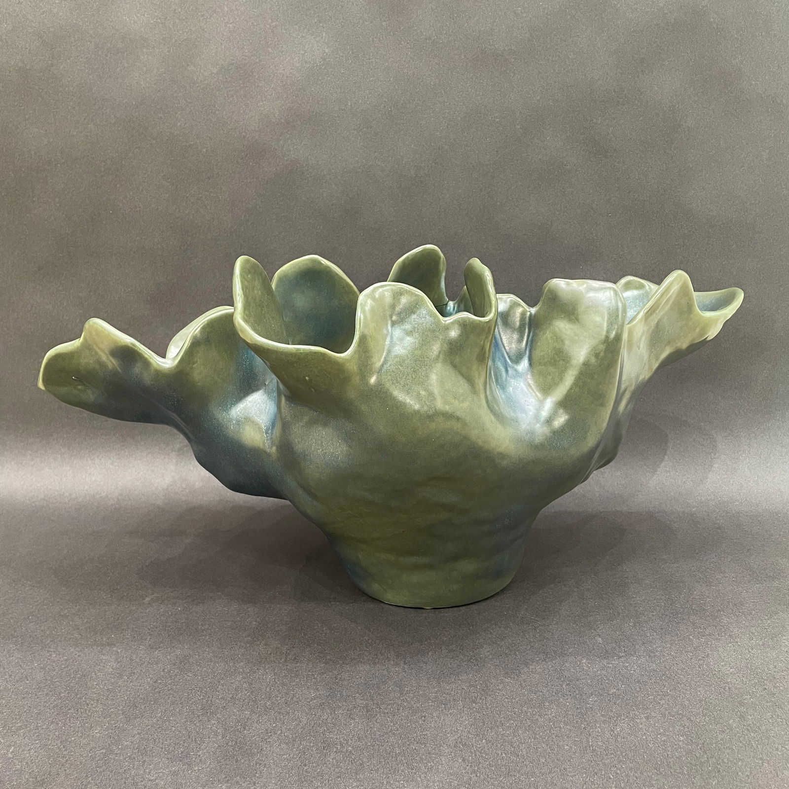 Global Views 10.5 H x 22 W Meteor Bowl: Artist: Global Views Studio Title: Meteor Bowl Medium: Ceramic Size: 10.5 H x 22 W x 13.5 D Weight: 7.8 lbs. This sculptural vessel features an organic, undulating form that feels inspired by nature