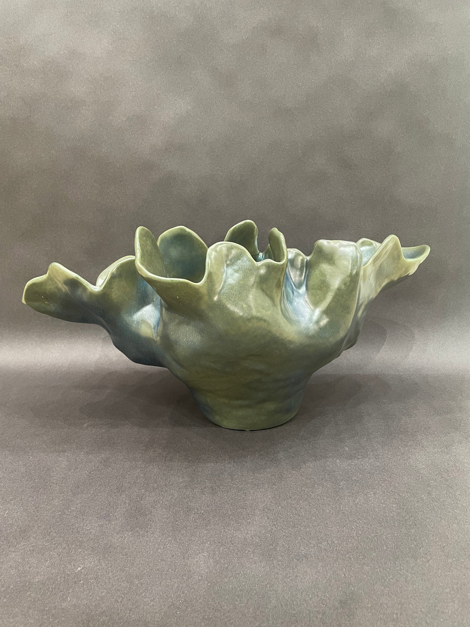 Global Views 10.5" H x 22" W Meteor Bowl: Artist: Global Views Studio Title: Meteor Bowl Medium: Ceramic Size: 10.5" H x 22" W x 13.5" D Weight: 7.8 lbs. Edition: Open This sculptural vessel features an organic, undulating form that feel