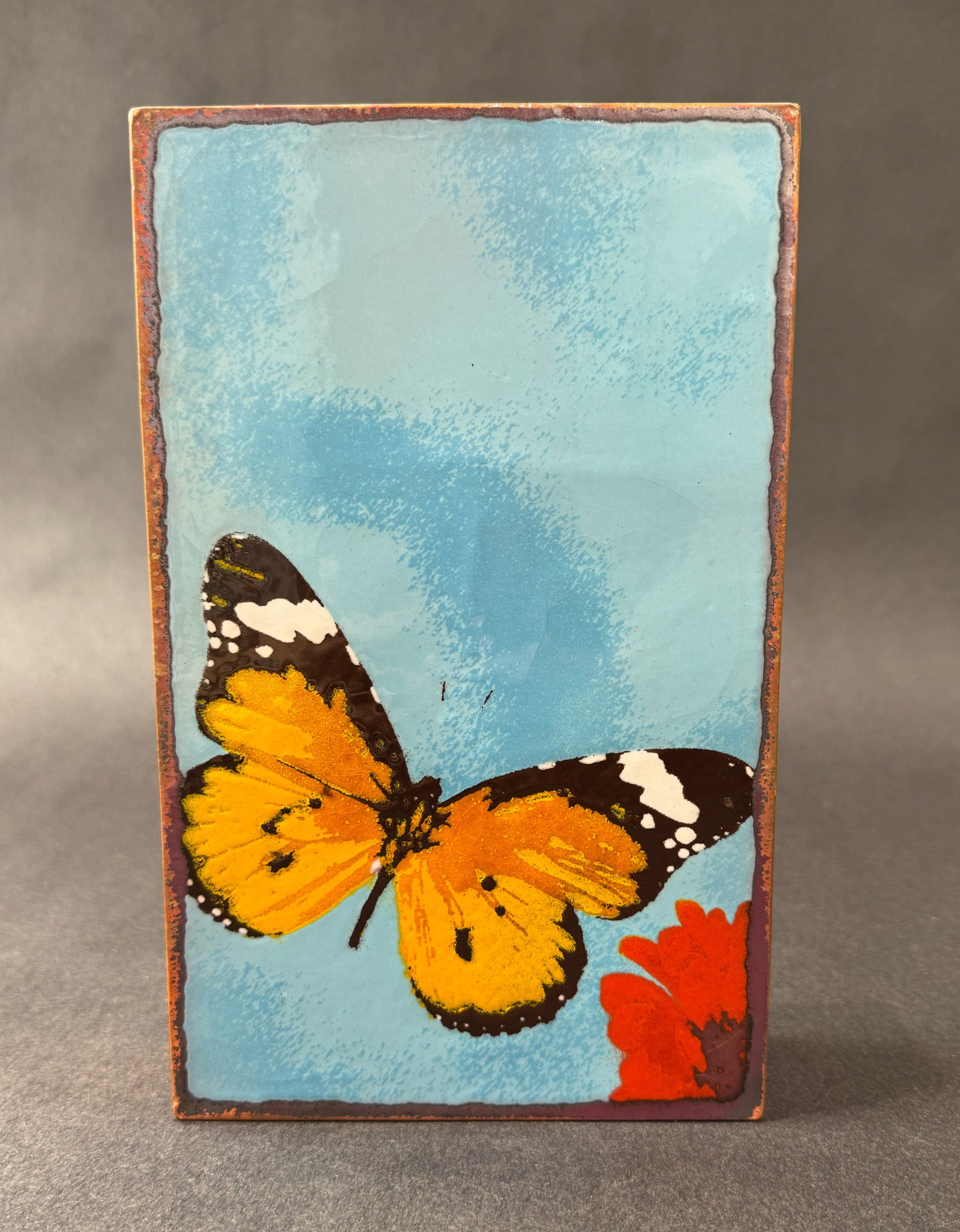 Houston Llew 8.5" H x 5.25" W Retired Spiritile 228: Chrysalis: Artist: Houston Llew (b. 1980s) American Title: 228: Chrysalis RETIRED Medium: Copper and Enamel on Wood Artwork Size: 8.5 H x 5.25 W x 1.75 D Weight: 2.5 lbs. Edition: Open This uplifting mixed-me
