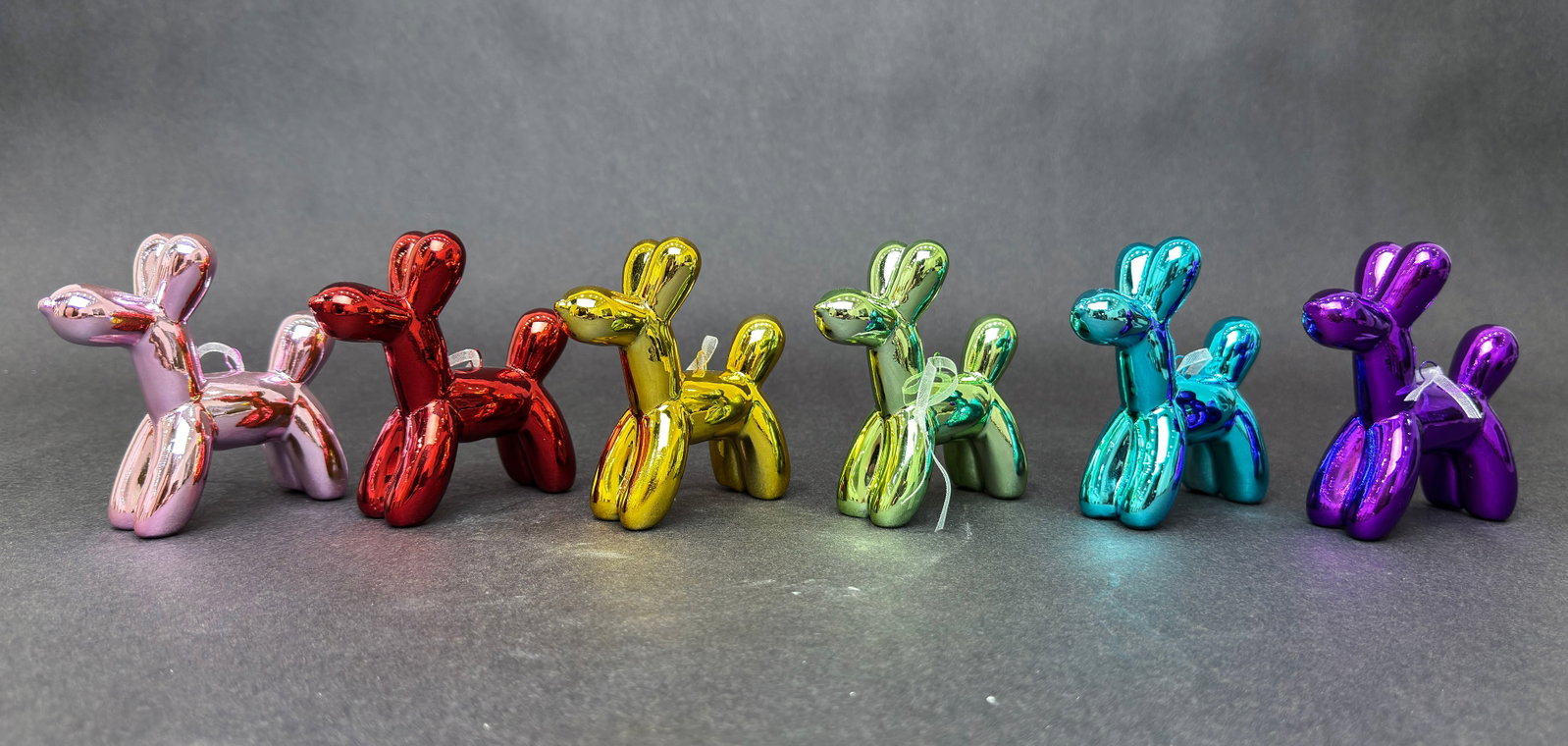Illusions 3.5” H x 1.25" W Balloon Dog Ornaments Set of 6: Artist: Interior Illusions Title: Balloon Dog Ornaments - Set of 6 Medium: Ceramic Artwork Size: 3.5” H x 1.25" W x 3.5" D each Weight: 3 lbs. Edition: Unlimited These playful balloon dog orname