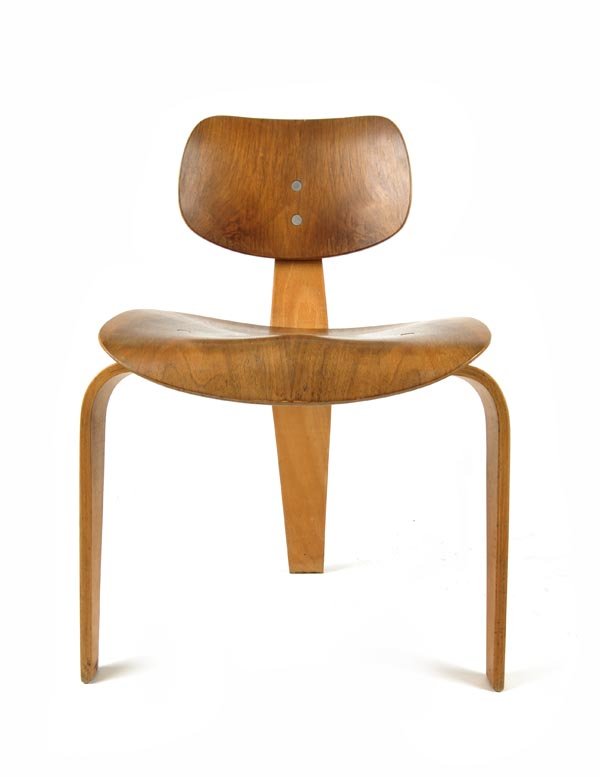Egon Eiermann, Chair, 1950: Model 'SE 42'. H. 73 cm; w. 46 cm; d. 46 cm. Execution: Wilde + Spieth, Oberesslingen, plywood, walnut veneer, stained middle brown, polished; black rubber cylindres serving as springs..Exhib. cat. Eg