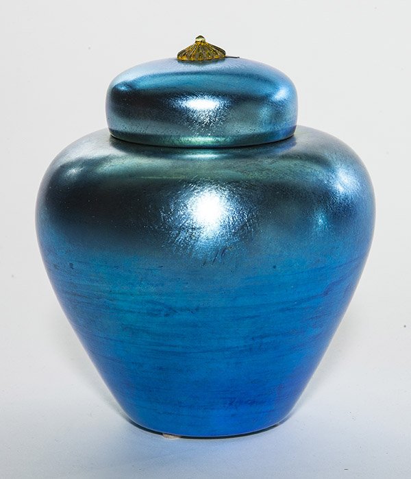 Durand covered jar, shouldered form in iridescent blue: Durand covered jar, shouldered form in iridescent blue with matching lid featuring an applied amber finial, signed "Durand 1964-6", 7 1/4" ht. LITERATURE: See Durand The Man and his Glass by Meschi, p