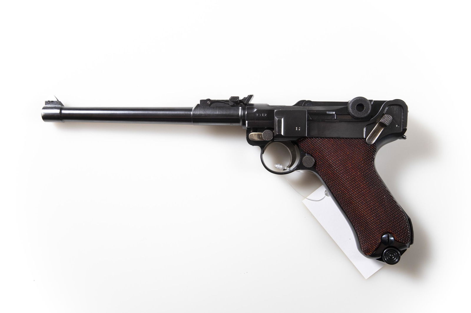 DWM 1917 DWM ARTILLERY 9MM W/SNAIL DRUM: Serial Number 7912i. PRISTINE CONDITION. This 1917 DWM Artillery 9mm comes with matching wood base magazine, 32 round trommel (snail drum) magazine and unnumbered wooden stock. NO RESERVE. Vandenbrook