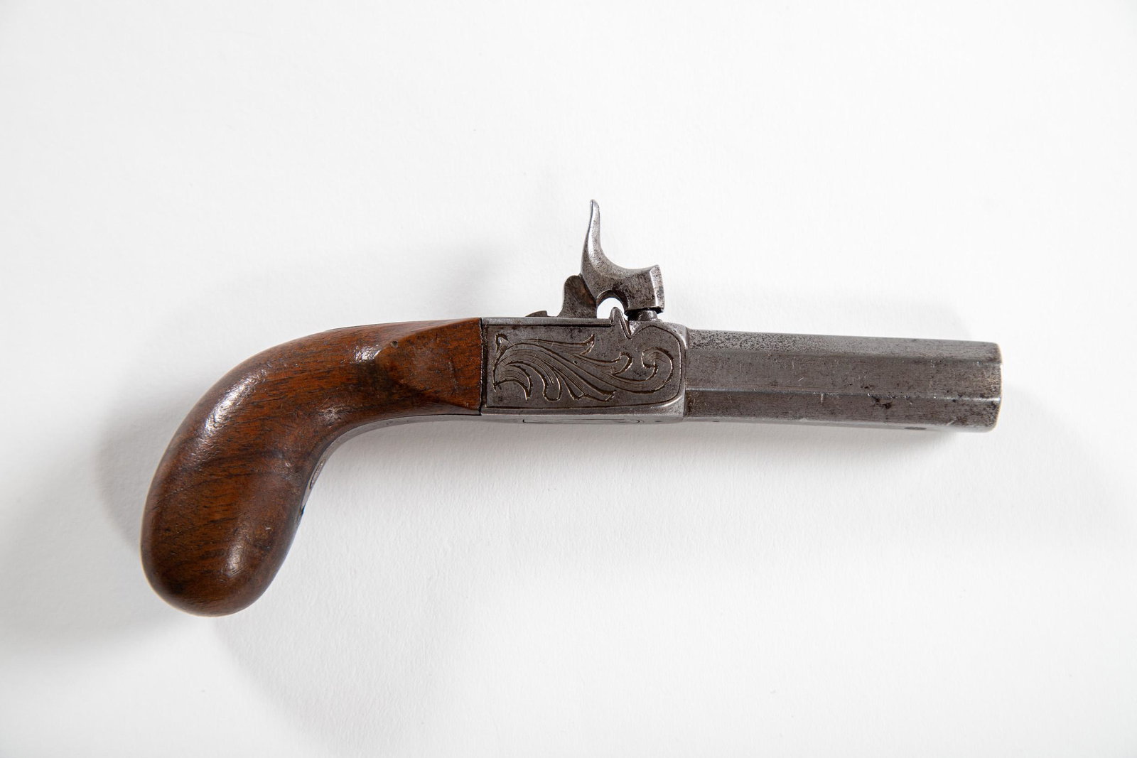 Engraved Pocket Pistol Derringer: Small caliber pocket pistol with inset trigger and etchings. NO RESERVE.