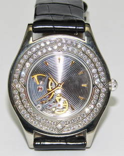 Palladium MAUBOUSSIN watch: Palladium MAUBOUSSIN wristwatch, 34 mm with a diamond bezel and leather strap. Case numbers: R11863, #110 Pa. Appraised Fair Market Value (FMV) is $4000.