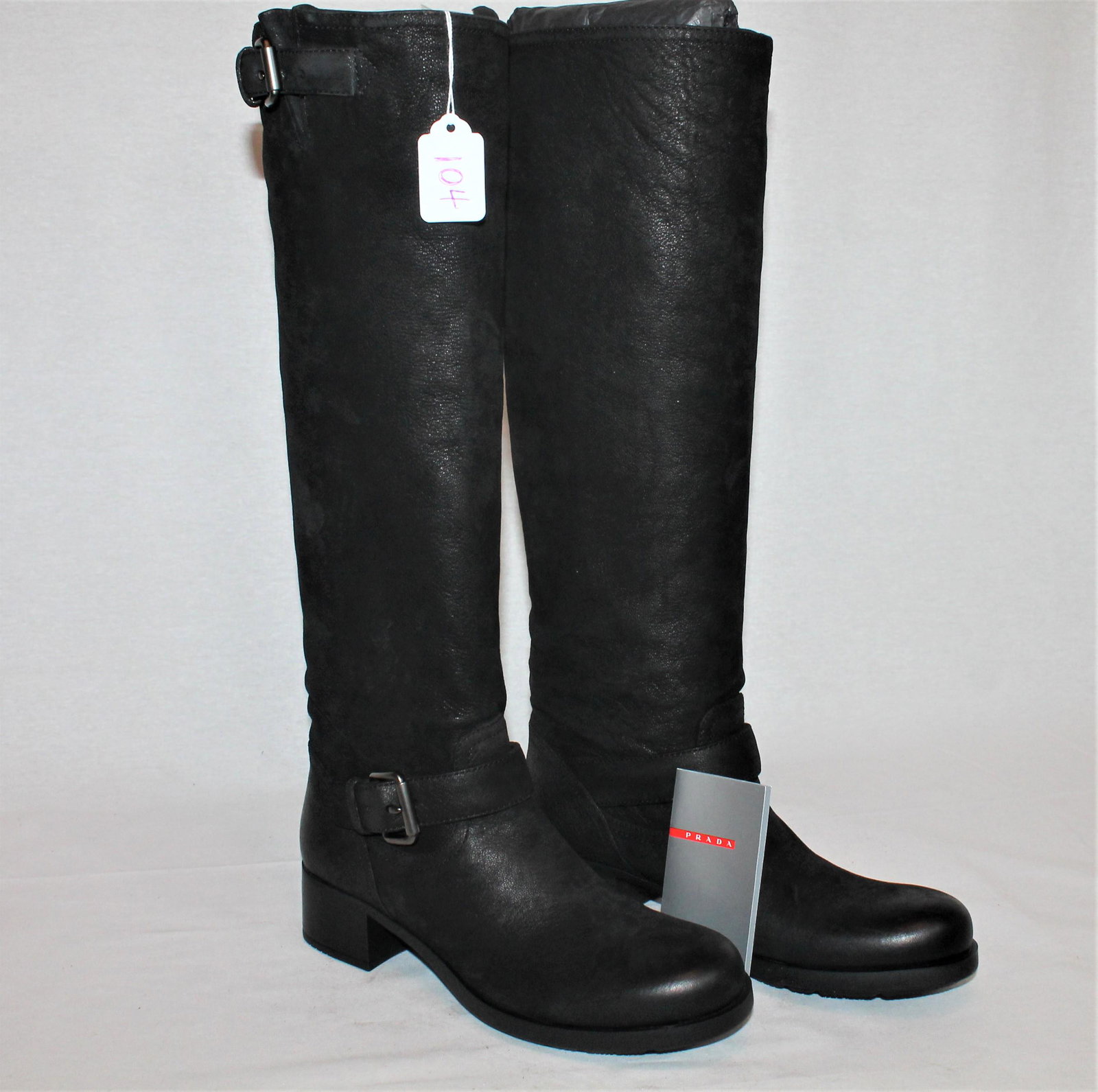 Prada knee-high boots: Bad to the Bone Prada boots! Knee-high with dual buckle detail on each boots. Size 37 – never worn – with original box.