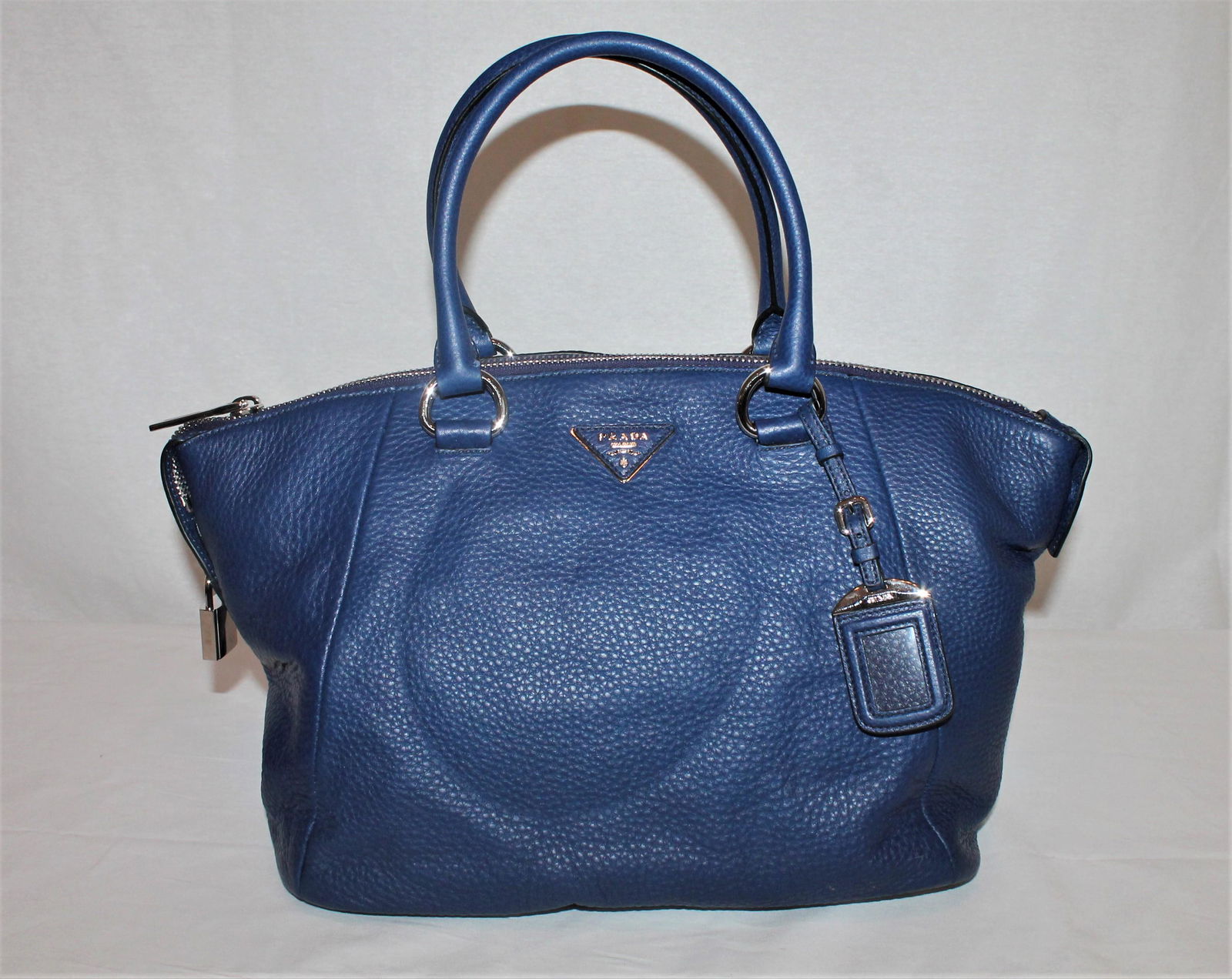Prada blue pebble leather bag: Prada blue pebble leather bag with metal hardware and zipper closure with lock – Stunning!