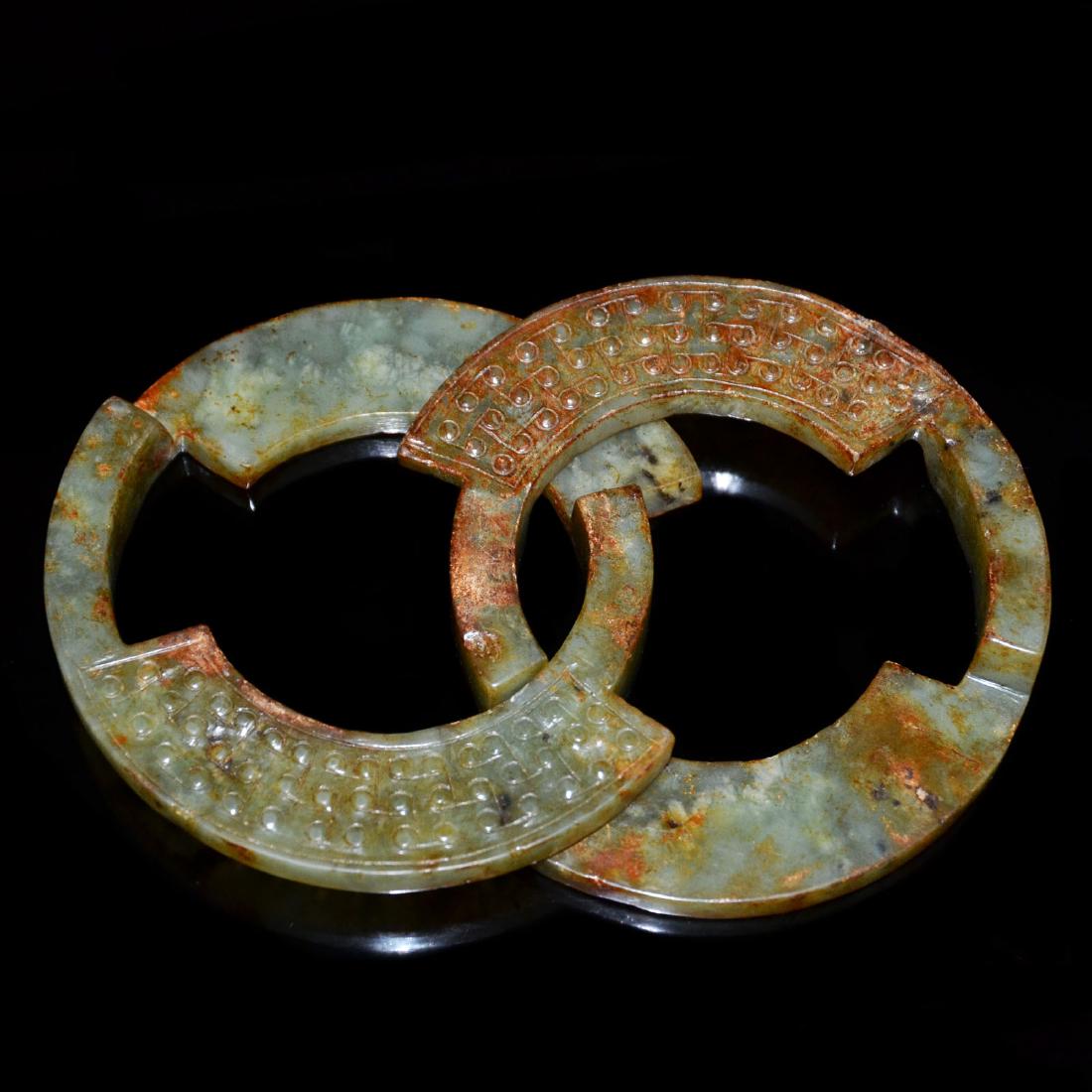 A Celadon Jade Double-Ring Carved with Boss Decorations (1 of 3)