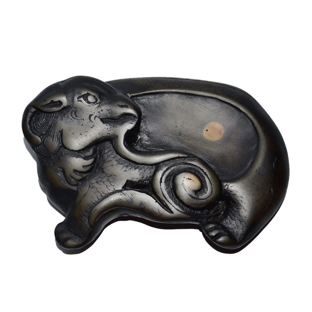 Ram-Form Duan Inkstone: 浮雕羊形端砚 Ram-Form Duan Inkstone Recumbent ram naturalistically carved with head turned and the body as recessed ink pool Length: 5⅛ in. (13 cm.)